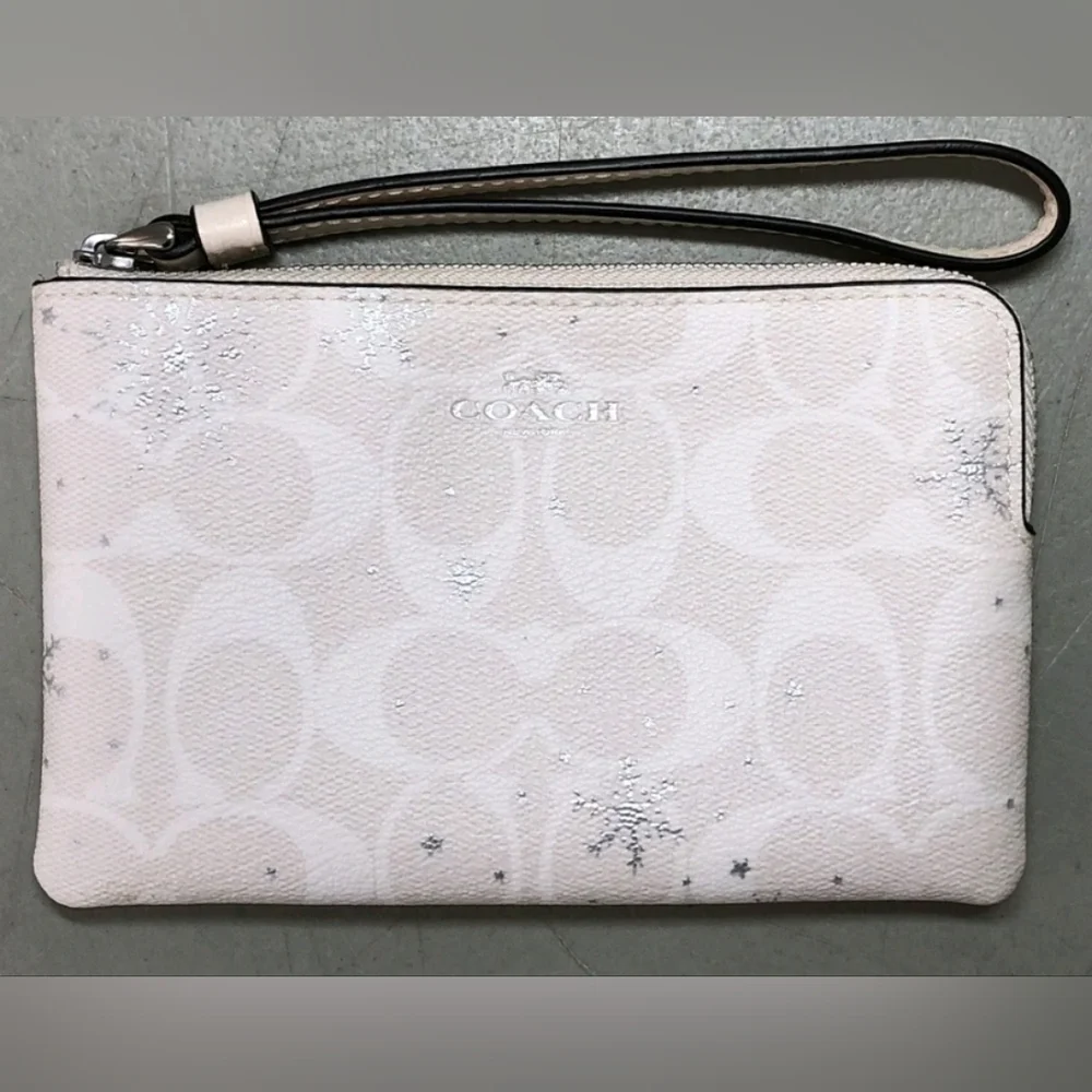 Coach Snowflakes white Wristlet.